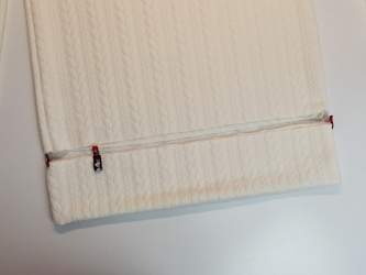 Coudre la bande du bas du pull