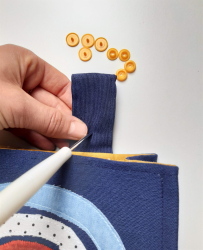 Fixer des boutons pression