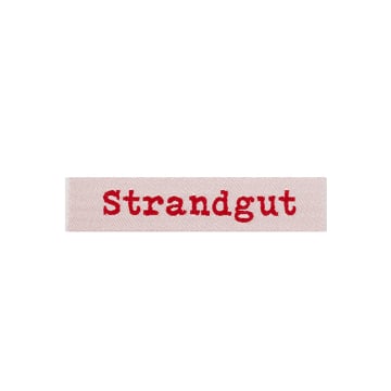 Étiquette vêtement Strandgut, rouge