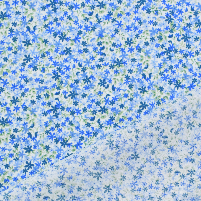 Tissu coton popeline Confettis de fleurs, bleu