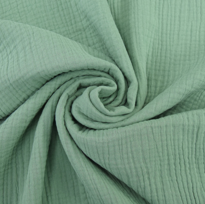 Katoenen mousseline triple gauze, vaalgroen