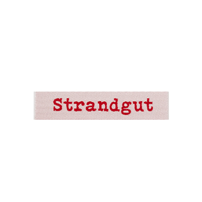 Étiquette vêtement Strandgut, rouge
