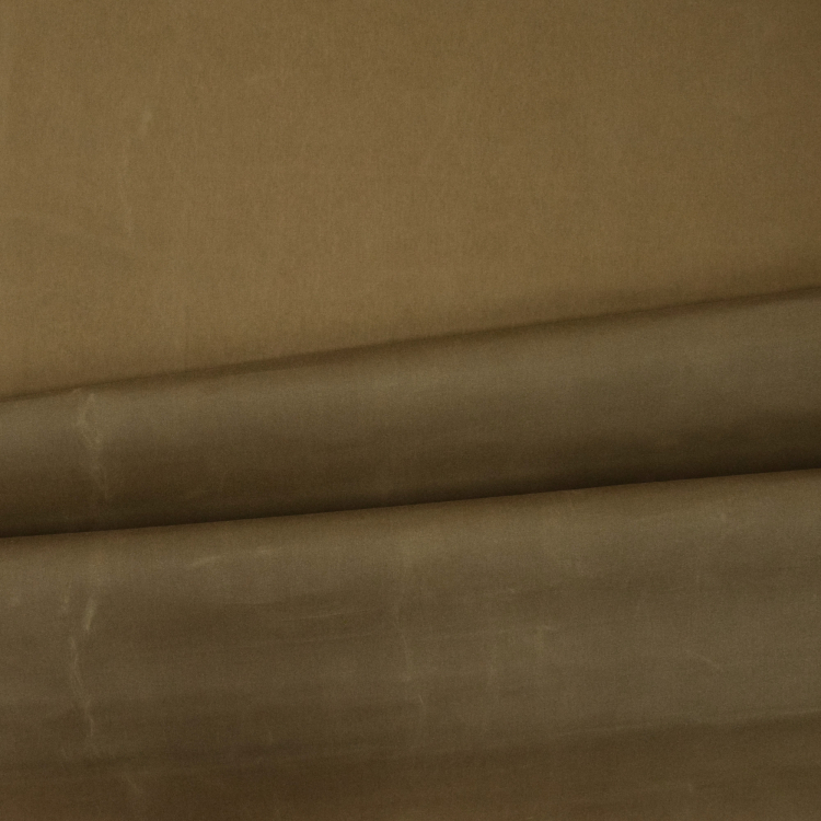 Oilskin waxed cotton, buff Fabrics Hemmers